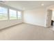 Bedroom with carpet, neutral walls, bright windows, and ample natural light at 3967 Descent St, Castle Rock, CO 80108