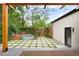 Charming backyard with stylish landscaping, a wooden pergola, string lights, and metal stock tank pool at 659 Albion St, Denver, CO 80220