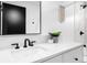Stylish bathroom with quartz countertop, black faucet, and modern vanity at 659 Albion St, Denver, CO 80220