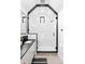 Modern bathroom with glass shower, stylish black accents and tiled walls at 659 Albion St, Denver, CO 80220