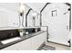 Bright bathroom with stylish lighting, double vanity, and walk-in shower at 659 Albion St, Denver, CO 80220
