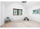 Bright carpeted bedroom with vaulted ceilings, a tent, and large windows at 659 Albion St, Denver, CO 80220