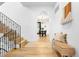 Inviting foyer showcasing hardwood floors, an open staircase, and a view into the dining area at 659 Albion St, Denver, CO 80220