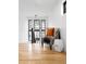 Sitting area with hardwood floors, chair, accent table and natural light at 659 Albion St, Denver, CO 80220