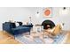 Inviting living room with a modern fireplace, plush seating, and a decorative rug at 659 Albion St, Denver, CO 80220