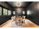 Stylish office with dark walls, modern furniture, and natural light streaming through the windows at 659 Albion St, Denver, CO 80220
