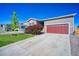 Charming single-Gathering home showcasing a well-maintained lawn and a red two-car garage door at 6221 N Easton Ave, Frederick, CO 80504