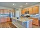 Spacious kitchen featuring a large island with granite countertops and stainless steel appliances at 6221 N Easton Ave, Frederick, CO 80504