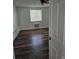 Bright bedroom featuring modern wood flooring and a window with natural light at 1304 S Parker Rd # 13, Denver, CO 80231