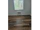 This bedroom has updated flooring, a window and air conditioning at 1304 S Parker Rd # 13, Denver, CO 80231