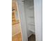 Open pantry featuring a white door and multiple shelves for storage at 1304 S Parker Rd # 13, Denver, CO 80231