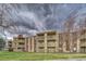 Well-maintained apartment building featuring balconies and lush landscaping at 1304 S Parker Rd # 13, Denver, CO 80231