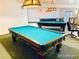 Spacious game room featuring multiple billiard tables and decorative lighting fixtures at 1304 S Parker Rd # 13, Denver, CO 80231