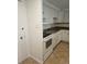 This kitchen has white cabinets and granite countertops at 1304 S Parker Rd # 13, Denver, CO 80231