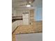 Kitchen featuring granite countertops, white cabinetry, and modern appliances at 1304 S Parker Rd # 13, Denver, CO 80231