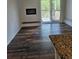 This living room has a fireplace, updated flooring and access to a balcony at 1304 S Parker Rd # 13, Denver, CO 80231