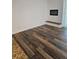 This living room has a fireplace, updated flooring and access to a balcony at 1304 S Parker Rd # 13, Denver, CO 80231