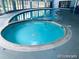 Relaxing indoor pool and hot tub area featuring large windows and ample natural light at 1304 S Parker Rd # 13, Denver, CO 80231