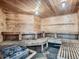 Interior view of a wooden sauna with multiple seating levels, offering a relaxing space at 1304 S Parker Rd # 13, Denver, CO 80231