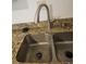 This sink has a brushed nickel faucet and granite countertops at 1304 S Parker Rd # 13, Denver, CO 80231