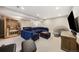 The basement includes a spacious lounge area, featuring a large sectional and an entertainment center at 5965 Hanover St, Denver, CO 80238