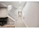 The spacious, neutral-colored basement features a staircase and has recessed lighting for a bright and open feel at 5965 Hanover St, Denver, CO 80238
