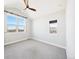 Bright bedroom featuring vaulted ceilings, a ceiling fan, and dual windows that provide ample natural light at 5965 Hanover St, Denver, CO 80238