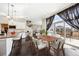 Inviting dining area adjacent to the kitchen, featuring a stylish table and large sliding doors to the patio at 5965 Hanover St, Denver, CO 80238