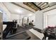 A well-equipped home gym featuring a treadmill, free weights, and other fitness equipment at 5965 Hanover St, Denver, CO 80238