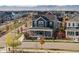 Charming two-story home featuring a welcoming front porch, modern architecture, and a beautifully landscaped neighborhood at 5965 Hanover St, Denver, CO 80238
