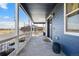 Charming covered front porch with blue siding and views of the neighborhood at 5965 Hanover St, Denver, CO 80238