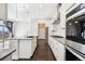 Stylish kitchen with stainless appliances, gray countertops, and a functional center island at 5965 Hanover St, Denver, CO 80238
