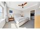 Serene main bedroom with tray ceiling, neutral colors, and ample natural light at 5965 Hanover St, Denver, CO 80238