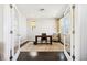 Bright office space featuring French doors, hardwood floors, and sunlit windows at 5965 Hanover St, Denver, CO 80238