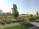 Scenic park area with picnic tables, shaded seating, and lush green space for outdoor enjoyment at 5965 Hanover St, Denver, CO 80238
