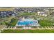 Community pool and recreation area with multiple pools, water slides, lounge chairs, and well-maintained landscaping at 5965 Hanover St, Denver, CO 80238