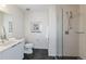 Modern bathroom featuring a glass-enclosed shower and sleek vanity with countertop at 3408 W 18Th Ave, Denver, CO 80204