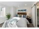 Bedroom featuring artwork, soft bedding, and natural light at 3408 W 18Th Ave, Denver, CO 80204