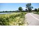 Scenic view of a community walking path alongside a lake at 3408 W 18Th Ave, Denver, CO 80204