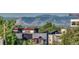 Modern townhomes with mountain views, lush greenery, and colorful architectural details at 3408 W 18Th Ave, Denver, CO 80204