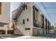 Modern townhome showing an exterior with balconies, garage, and contemporary architectural details at 3408 W 18Th Ave, Denver, CO 80204