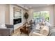 Inviting living room featuring a fireplace and access to an outdoor balcony at 3408 W 18Th Ave, Denver, CO 80204