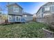 Spacious backyard with mature trees offering shade and privacy at 7586 Halleys Dr, Littleton, CO 80125
