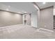 Finished basement with neutral paint, recessed lighting, closet, and carpet at 7586 Halleys Dr, Littleton, CO 80125