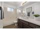 Traditional bathroom with a tiled shower and vanity at 7586 Halleys Dr, Littleton, CO 80125