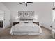 Bright bedroom featuring neutral decor, a ceiling fan, and plush carpeting at 7586 Halleys Dr, Littleton, CO 80125