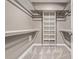 Walk-in closet with built-in shelving and hanging rods for optimal organization at 7586 Halleys Dr, Littleton, CO 80125