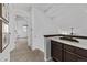 Upstairs hallway featuring a wet bar and view of a bedroom at 7586 Halleys Dr, Littleton, CO 80125