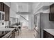 Open concept kitchen and living space offering modern appliances and easy access to the dining area at 7586 Halleys Dr, Littleton, CO 80125