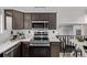 Updated kitchen with stainless steel appliances and modern finishes, perfect for cooking and entertaining at 7586 Halleys Dr, Littleton, CO 80125